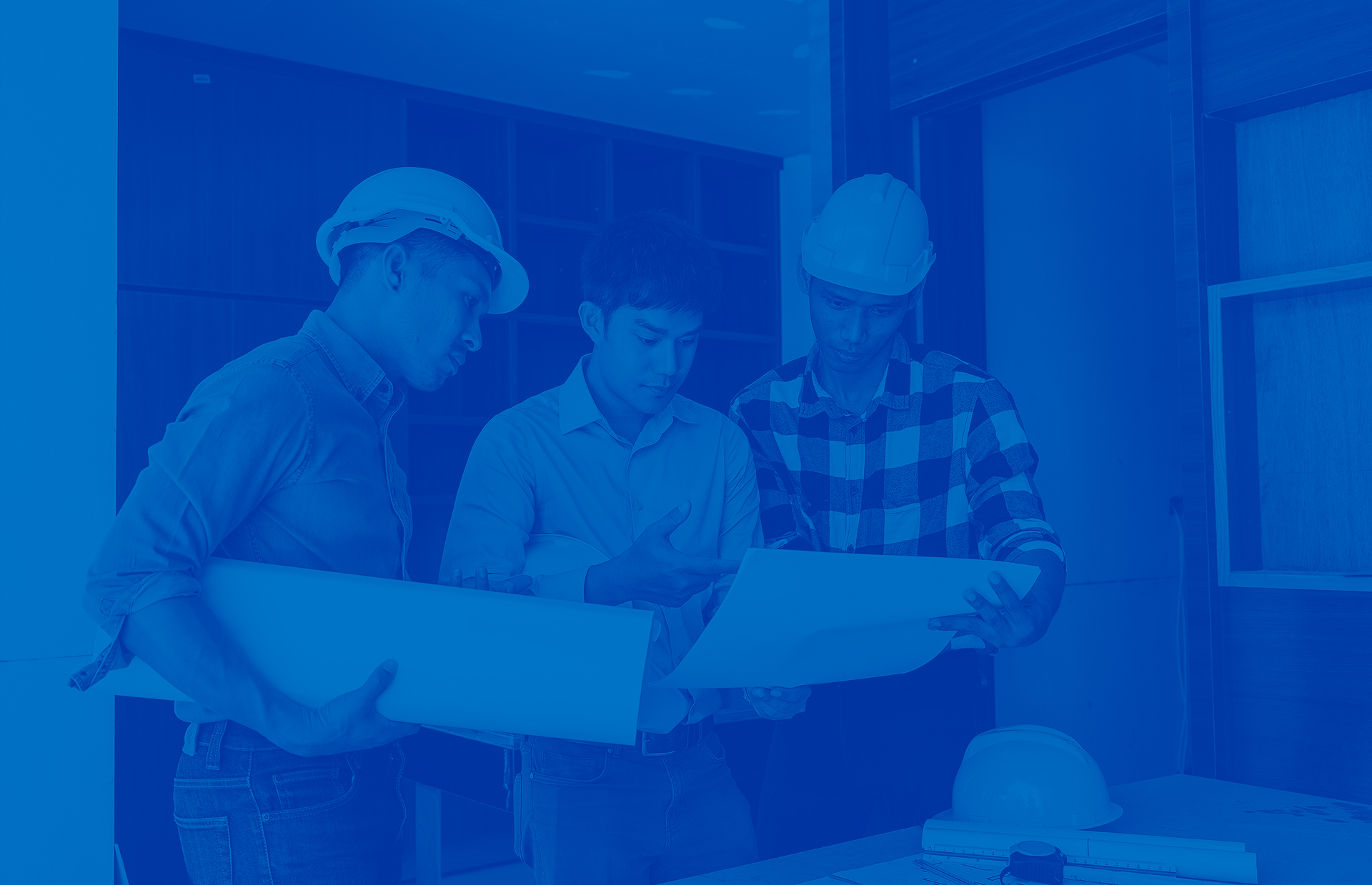 Industry Professionals Blue overlay of 3 industry professionals holding plans for a home closet.